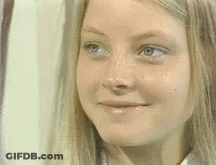 Close Up Of Woman's Face With Blonde Hair And Blue Eyes GIF