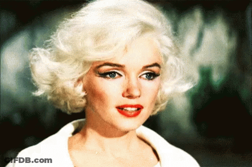 Close Up Of Woman's Face With Blonde Hair And Red Lips GIF