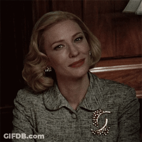Close Up Of Woman's Face With Brooch GIF