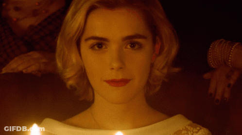 Close Up Of Woman's Face With Candle In Front GIF