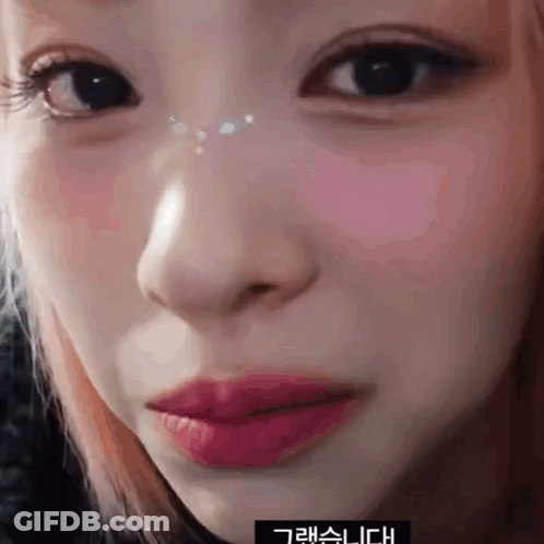 Close Up Of Woman's Face With Chinese Writing GIF