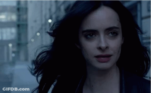 Close Up Of Woman's Face With Dark Hair GIF