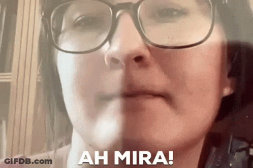 Close Up Of Woman's Face With Glasses And Words Ah Mira GIF