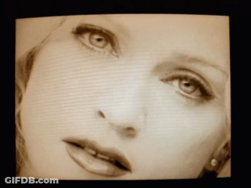 Close Up Of Woman's Face With Green Eyes GIF