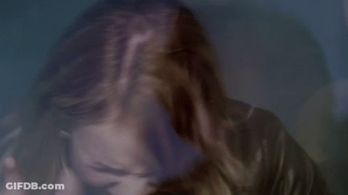 Close Up Of Woman's Face With Hair Flying In Wind GIF