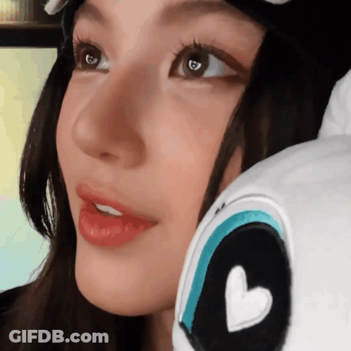 Close Up Of Woman's Face With Heart On Eye GIF