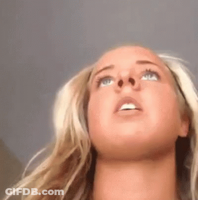 Close Up Of Woman's Face With Mouth Open Looking Up GIF