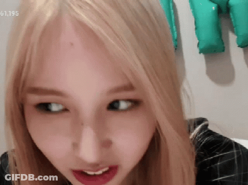 Close Up Of Woman's Face With Number 61195 GIF