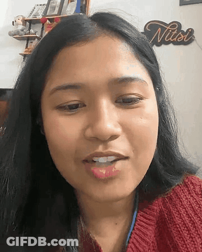 Close Up Of Woman's Face With Nuts Sign GIF