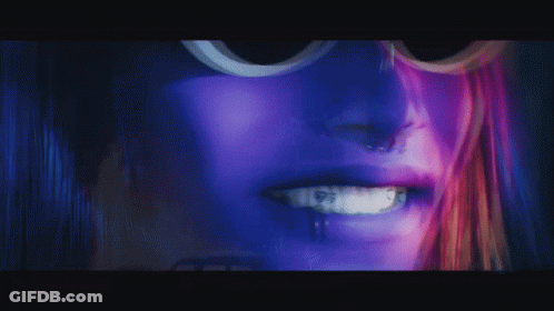 Close Up Of Woman's Face With Purple Hair GIF