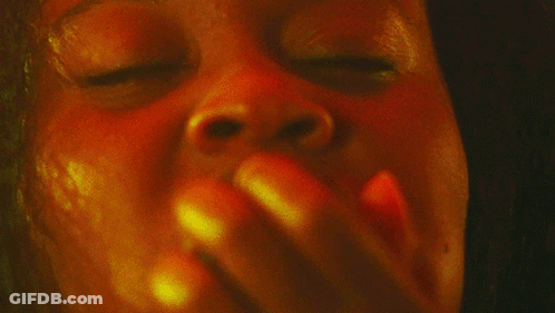 Close Up Of Woman's Face With Yellow And Red Background GIF