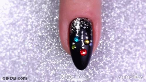 Close Up Of Woman's Nails With Rhinestones GIF