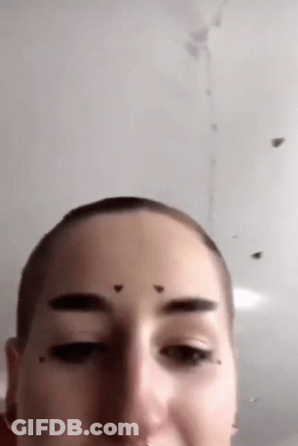 Close Up Of Woman's Shaved Head GIF