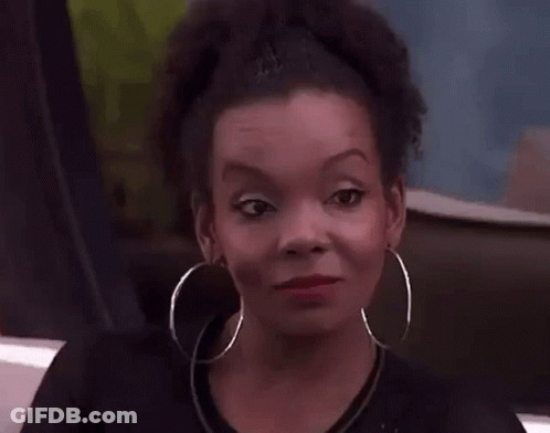 Close Up Of Woman Wearing Hoop Earrings Making Funny Face GIF