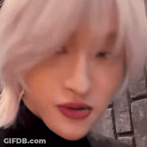 Close Up Of Woman With Blonde Hair And Red Lips GIF