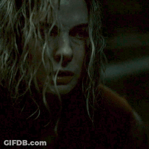 Close Up Of Woman With Ceiling Light In Background GIF
