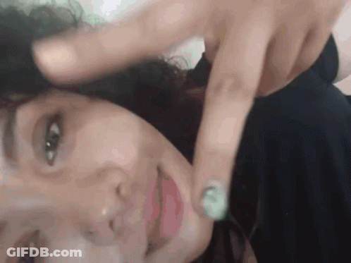Close Up Of Woman With Finger On Face GIF