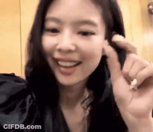 Close Up Of Woman With Hand To Ear Smiling GIF