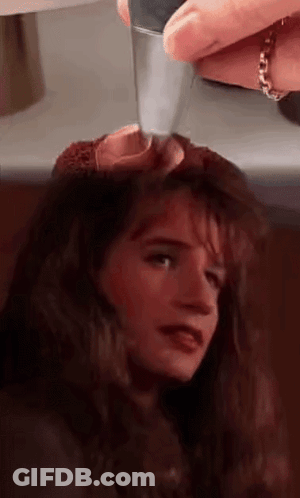 Close Up Of Woman With Knife In Head GIF