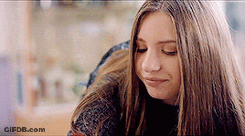 Close Up Of Woman With Long Hair Looking Down GIF