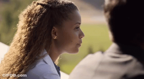 Close Up Of Woman With Man Behind Her GIF