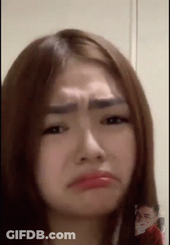 Close Up Of Woman With Man In Background GIF