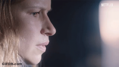 Close Up Of Woman With Netflix Logo GIF