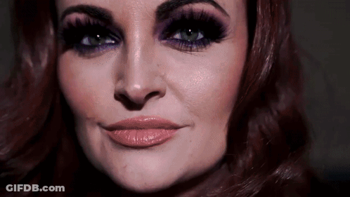 Close Up Of Woman With Purple Makeup GIF