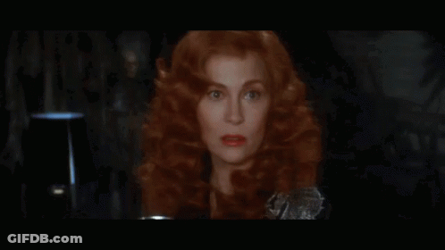 Close Up Of Woman With Red Hair And Red Lips GIF