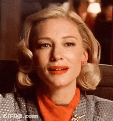 Close Up Of Woman With Red Lipstick And Gray Jacket GIF