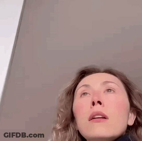 Close Up Of Woman With Slight Smirk GIF