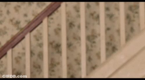 Close Up Of Wooden Staircase Railing GIF