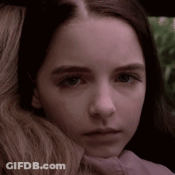 Close Up Of Young Girl With Woman Arm Around Neck GIF