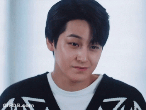 Close Up Of Young Man In Black And White Sweater GIF
