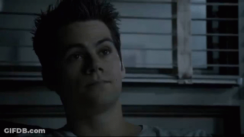 Close Up Of Young Man's Face In Front Of Window With Blinds GIF