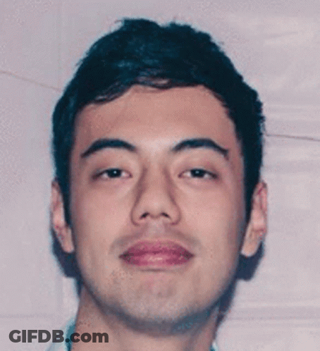 Close Up Of Young Man Slight Smile GIF