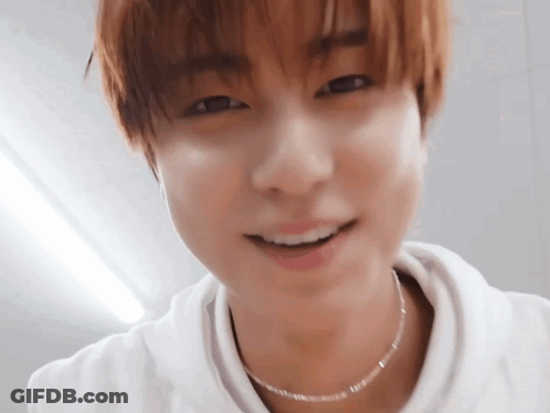 Close Up Of Young Man Wearing Necklace And White Shirt GIF