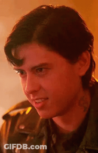 Close Up Of Young Man With Neck Tattoo And Leather Jacket GIF