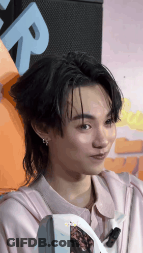 Close Up Person Face With Letter R Behind GIF
