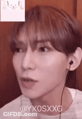 Close Up Person Face With Teddy Bear Behind GIF