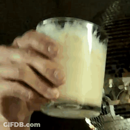 Close Up Person Holding Cup Of Milk GIF