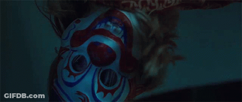 Close Up Person In Clown Mask In Dark GIF