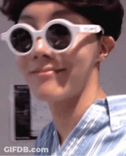 Close Up Person In Sunglasses Making Funny Face GIF