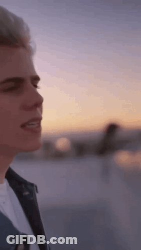 Close Up Person's Face With Sunset GIF
