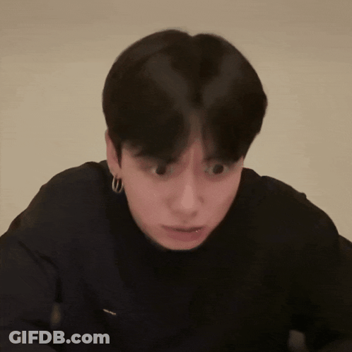Close Up Person With Black Shirt And Hoop Earrings GIF