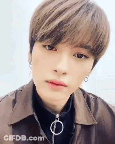Close Up Person With Brown Jacket And Earrings GIF