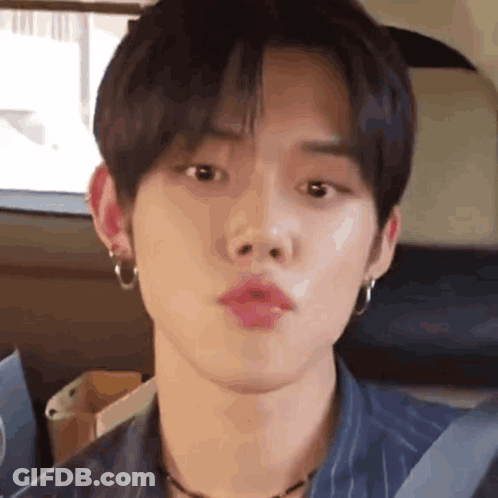 Close Up Person With Mouth Open And Earrings GIF