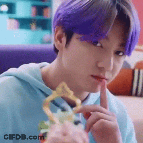 Close Up Person With Purple Hair Holding Trophy GIF