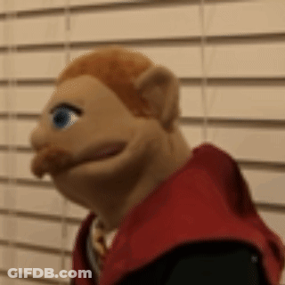 Close Up Puppet With Red Hair And Mustache GIF
