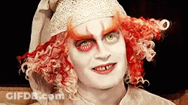 Close Up Red Hair White Face Paint GIF